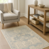 Neutral-toned rug styled in a small cozy space