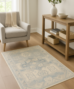 Neutral-toned rug styled in a small cozy space