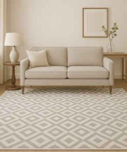 Traditional beige and ivory area rug styled in a cozy living room