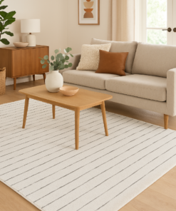 Contemporary rug styled in a neutral-toned living room